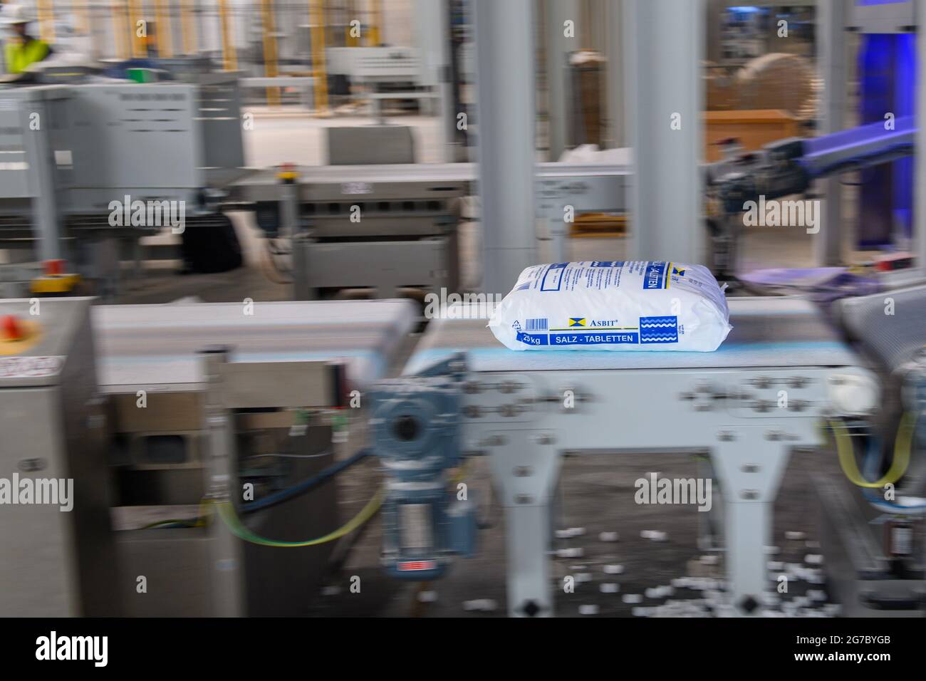 12 July 2021, Saxony-Anhalt, Staßfurt: A salt tablet produced and packaged  at the new plant of the chemical company Ciech lies on a conveyor belt.  Ciech is one of the leading producers