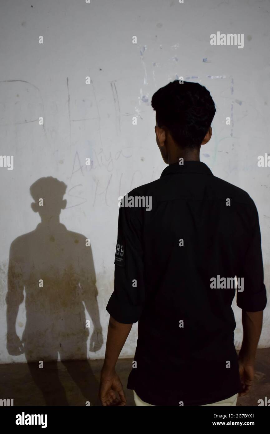 Man and his shadow Stock Photo - Alamy