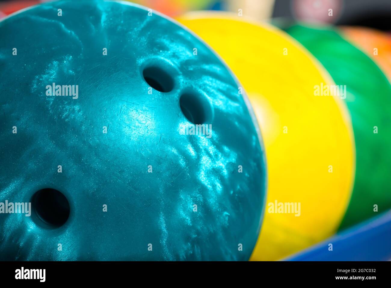 Colorful bowling balls in front of the tenpin alley Stock Photo