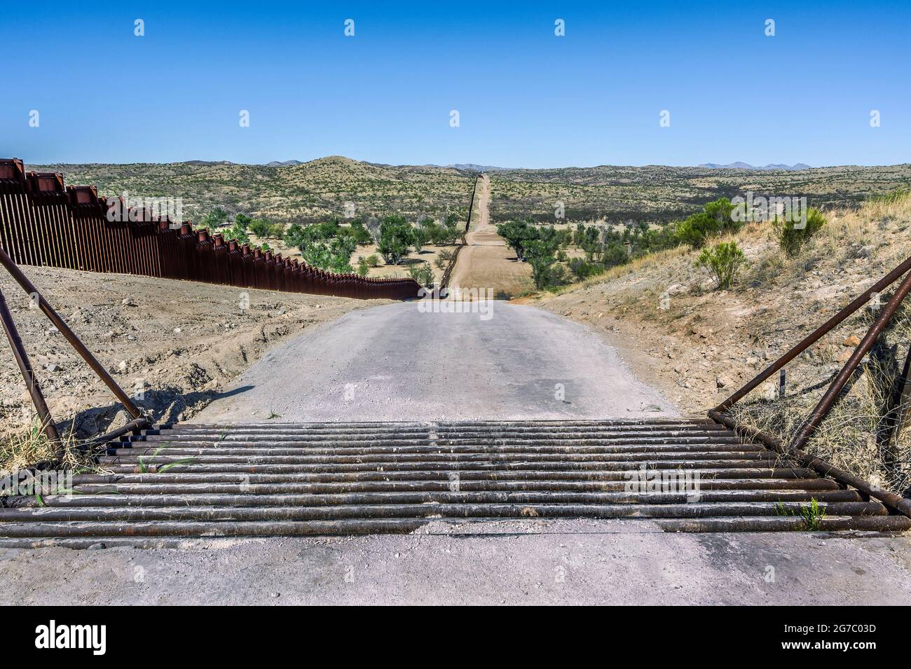 Cattle guard beside US border fence on the Mexico border, east of Nogales Arizona USA, and Nogales Sonora Mexico, viewed from US side. This type of ba Stock Photo