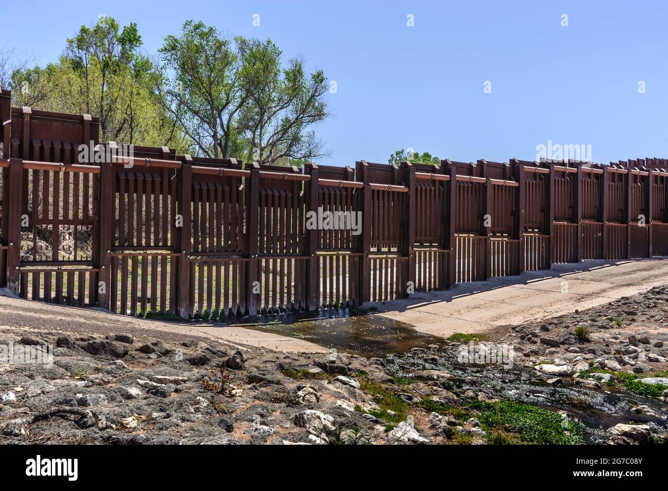 US border fence on the Mexico border, east of Nogales Arizona USA, and Nogales Sonora Mexico, viewed from US side. This view shows a location where th Stock Photo