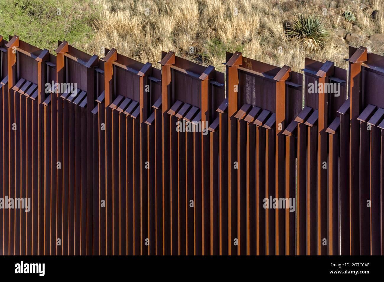 US border fence on the Mexico border, east of Nogales Arizona USA, and Nogales Sonora Mexico, viewed from US side. This view shows detail of top of fe Stock Photo