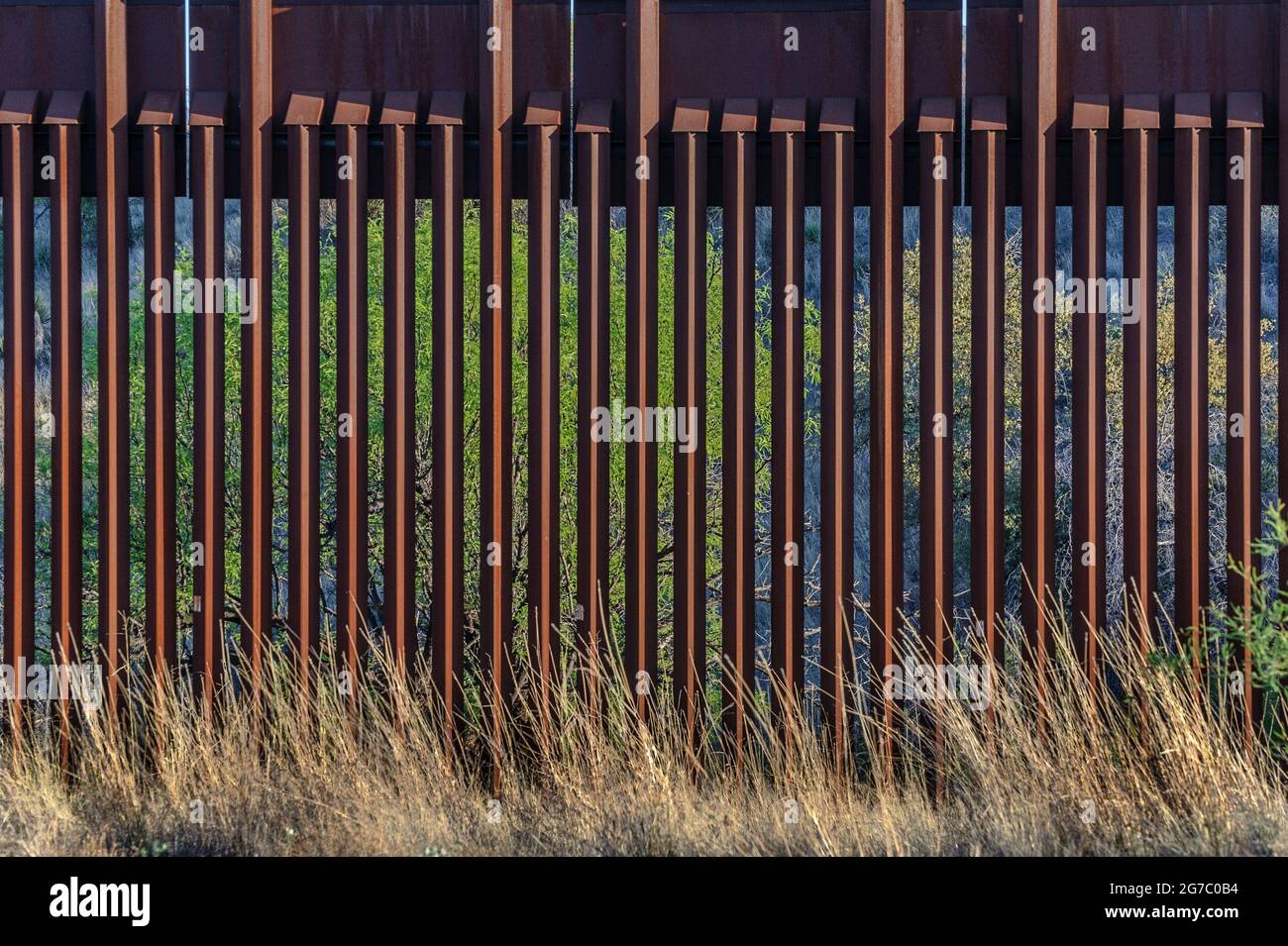 Close up view of US border fence on the Mexico border, east of Nogales Arizona USA, and Nogales Sonora Mexico, viewed from US side. This type of barri Stock Photo