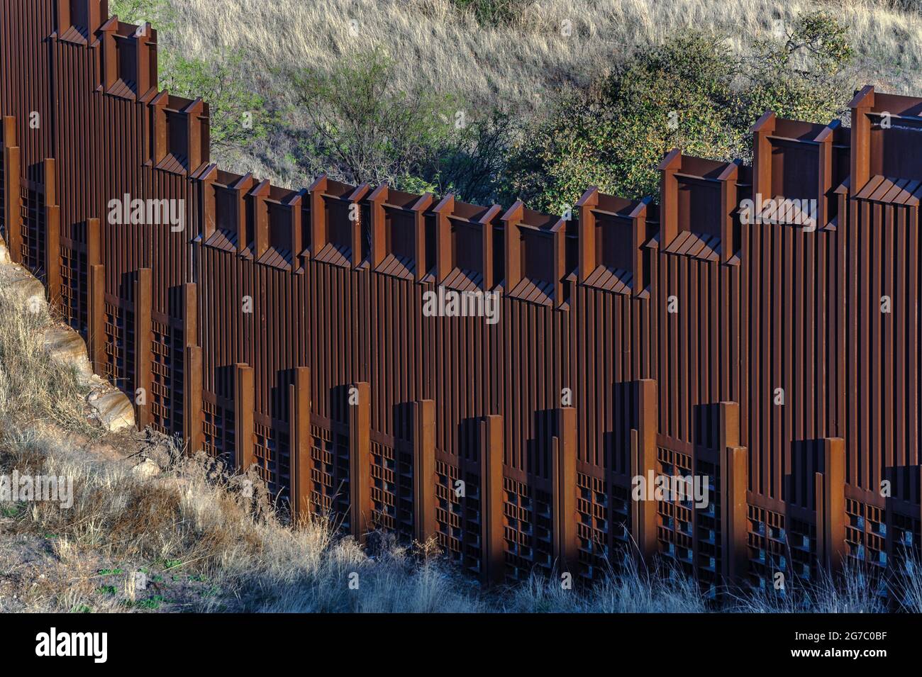 Detail view of US border fence on the Mexico border, east of Nogales Arizona USA, and Nogales Sonora Mexico, viewed from US side. Note the design for Stock Photo