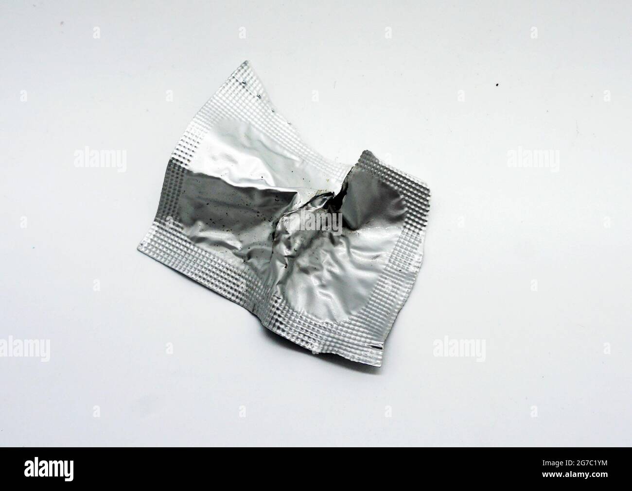 Used aluminum foil sachets will be disposed of in the trash. Stock Photo