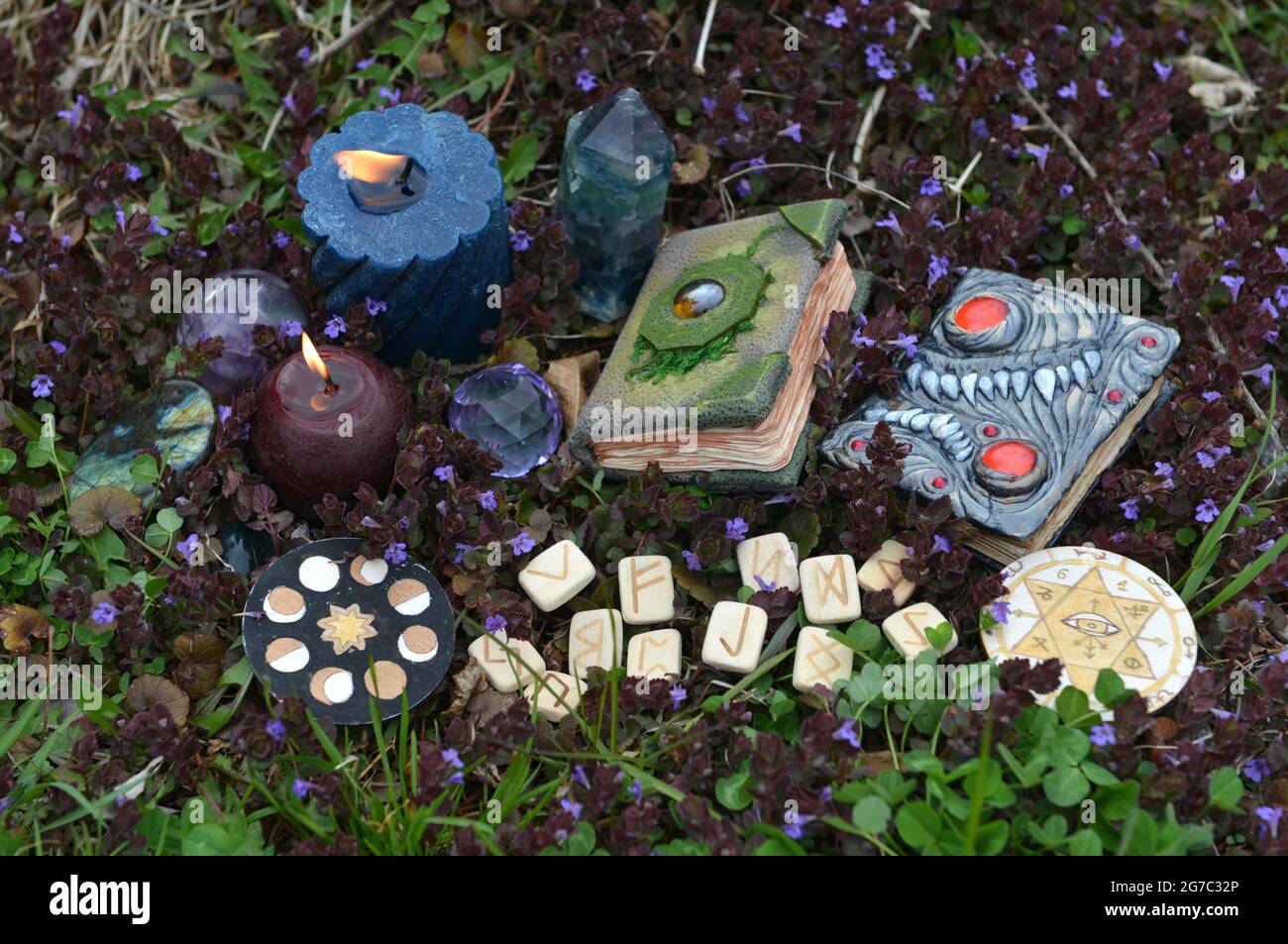 Beltane ritual still life with witch magic books, runes, crystals and ...