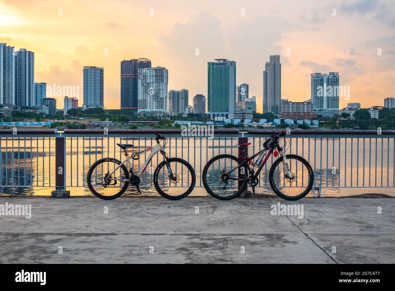 Two road bikes parked at the Woodlands waterfront promenade. Stock Photo