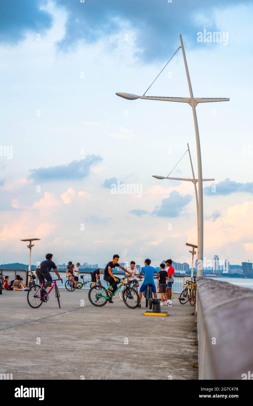 Evening scene of crowd at the Woodlands waterfront promenade. Stock Photo