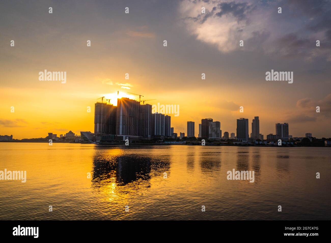 Sunset view from Woodlands Waterfront Park in central Singapore. Stock Photo