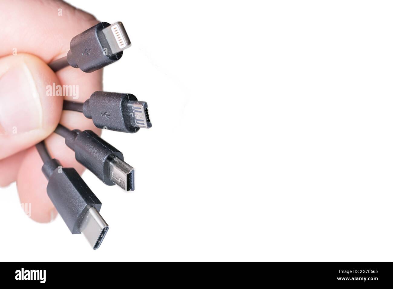 Four types of charging cables in front of white background with copy