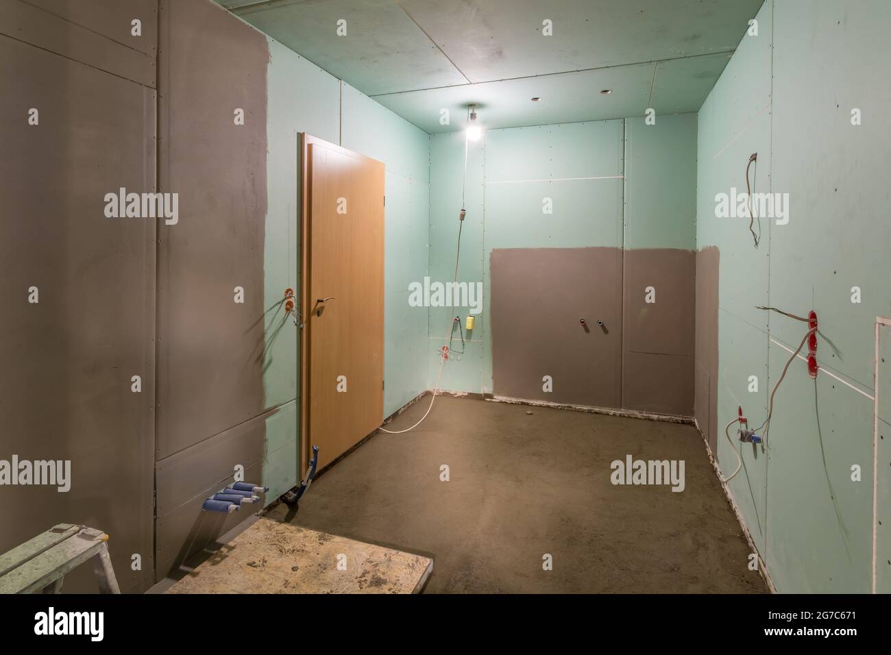 Renovation of a bathroom with drywall, a floor of screed concrete and