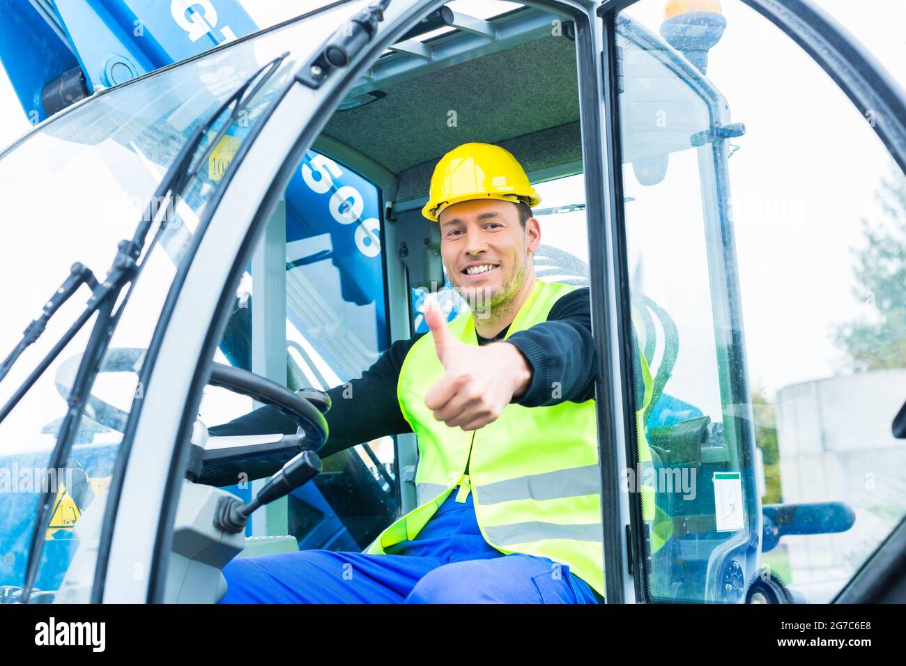 Construction worker driving excavation equipment hi-res stock ...