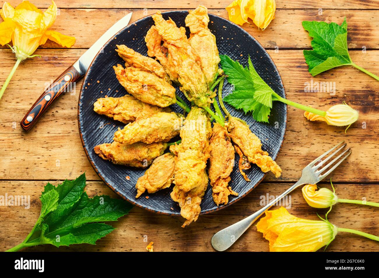 Fried zucchini flowers stuffed cottage cheese.Roasted courgette flowers