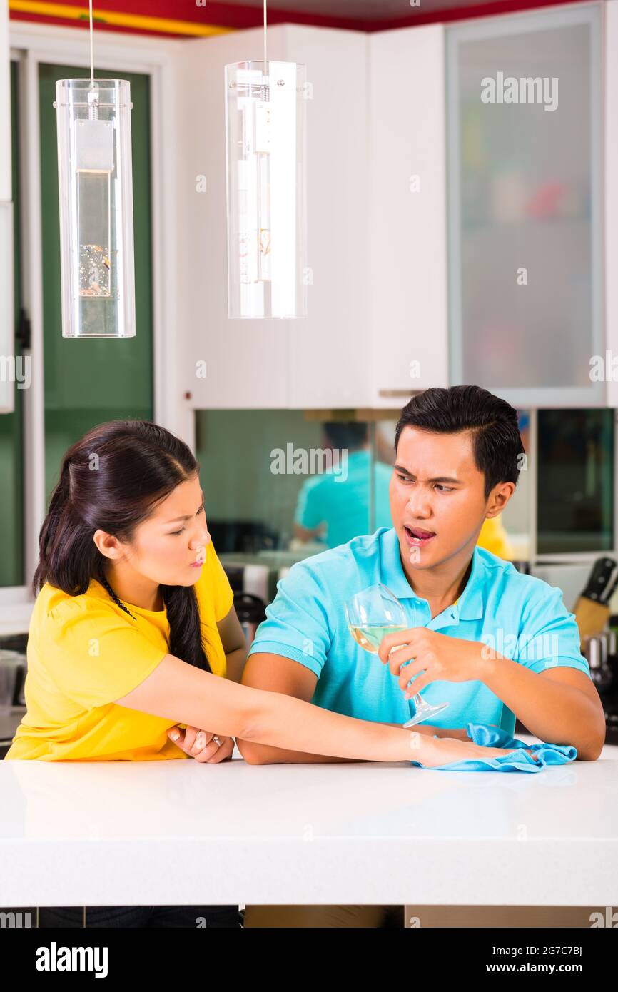 Young Asian handsome couple having relationship difficulties with alcohol problems and domestic violence Stock Photo