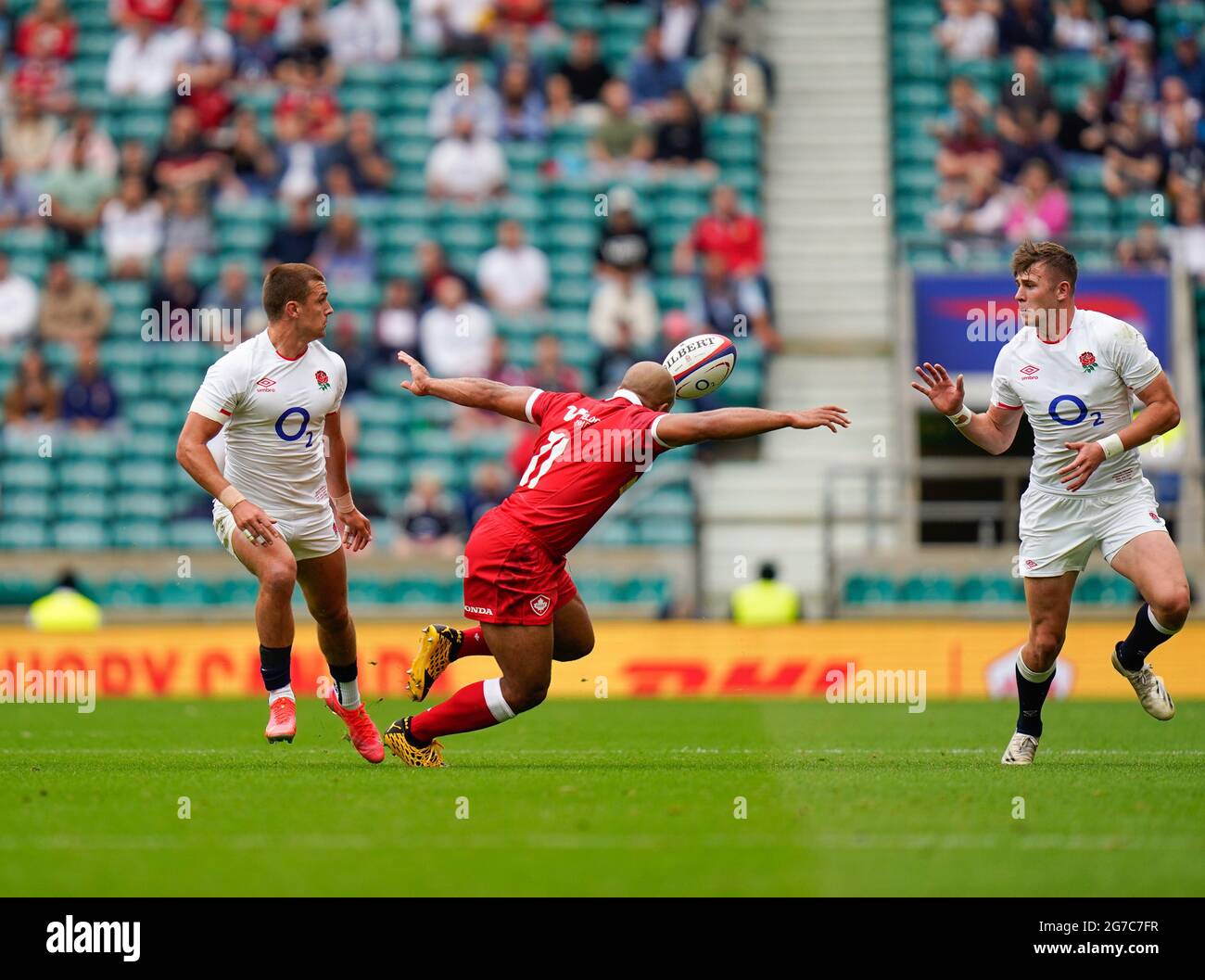 England centre Henry Slade passes to fullback Freddie Steward during the England -V- Rugby Canada match on Saturday, July 10, 2021, at Twickenham Stad Stock Photo