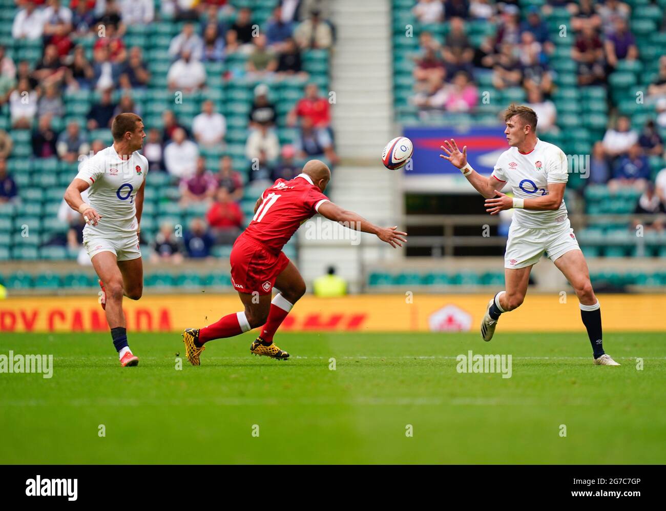 England centre Henry Slade passes to fullback Freddie Steward during the England -V- Rugby Canada match on Saturday, July 10, 2021, at Twickenham Stad Stock Photo