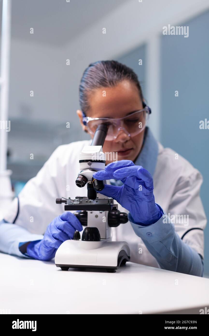 Specialist pharmacist examining bacteriology infection lab test using