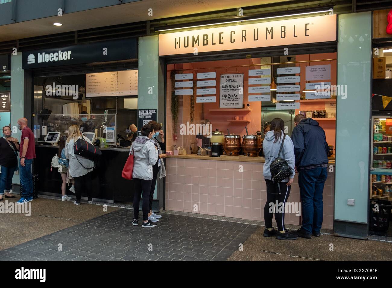 London- July, 2021: Food stalls inside Spitalfields Market.  A popular market with food, bars, arts and crafts Stock Photo