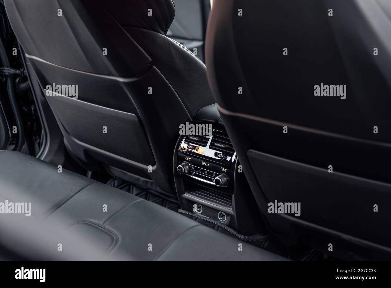 Interior of a premium car. The back seat of prestige luxury modern car