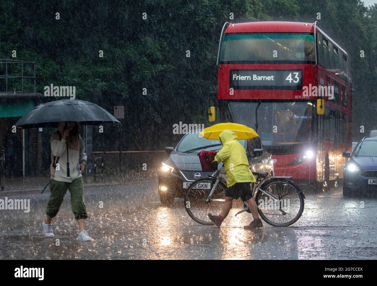 Pic shows: Highgate North London lightning thunder storms and torrential rain flooded the roads and caught commuters short today 12.7.21 Early evening Stock Photo