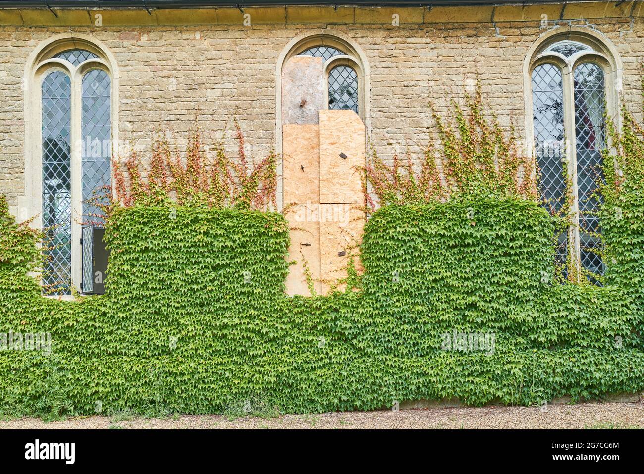Boarded window at the Creed chapel built by Jemima Creed in the english village of Ashton in 1726, rebuilt by Charles Rothschild in 1900. Stock Photo