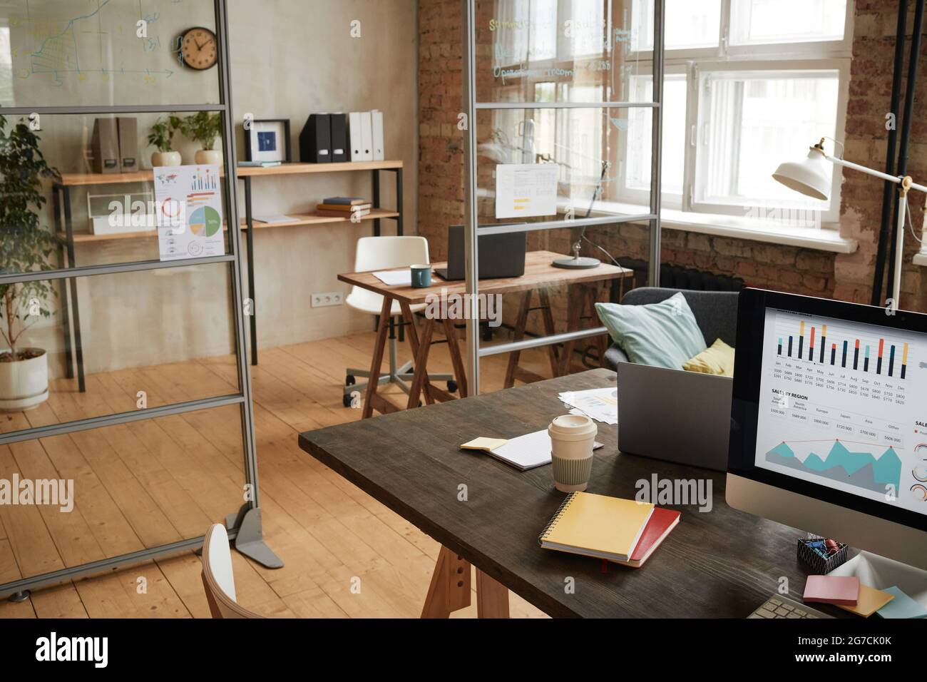 Image of empty modern office with workplace with computer on it Stock Photo