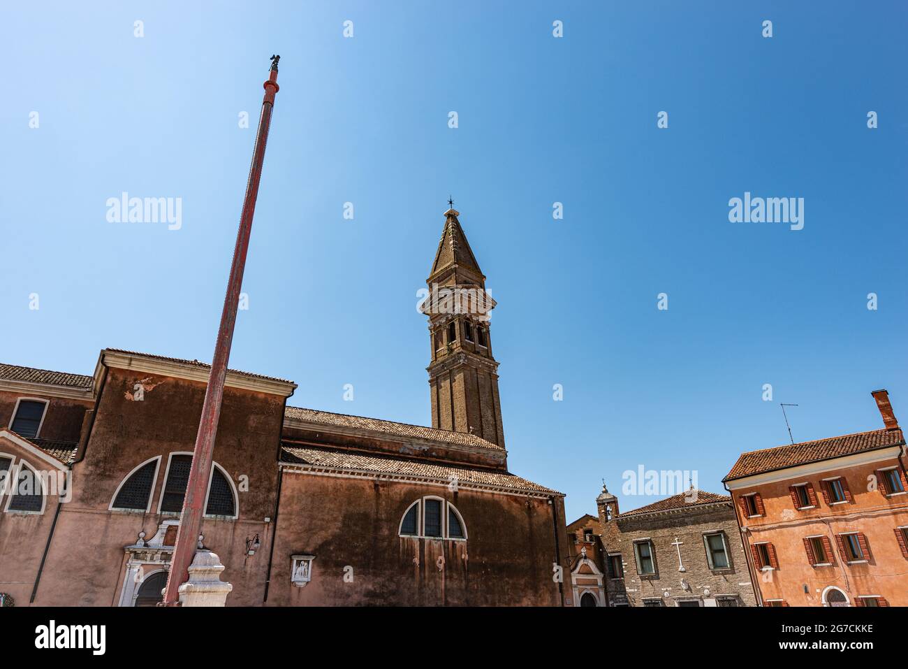 Burano island. Parish church of San Martino Vescovo (Saint Martin Bishop) and the leaning bell tower (XVI century), Piazza Baldassarre Galuppi, Venice Stock Photo