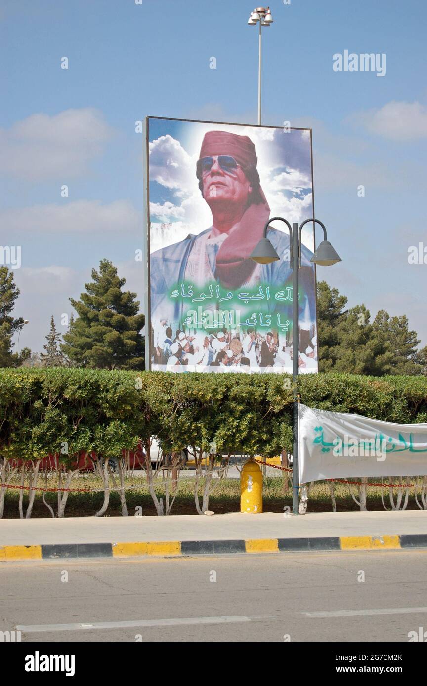 Tripoli, Libya - March 26, 2006: Giant poster of the dictator Colonel Gaddafi looming over the entrance to Tripoli Airport in Libya. Stock Photo