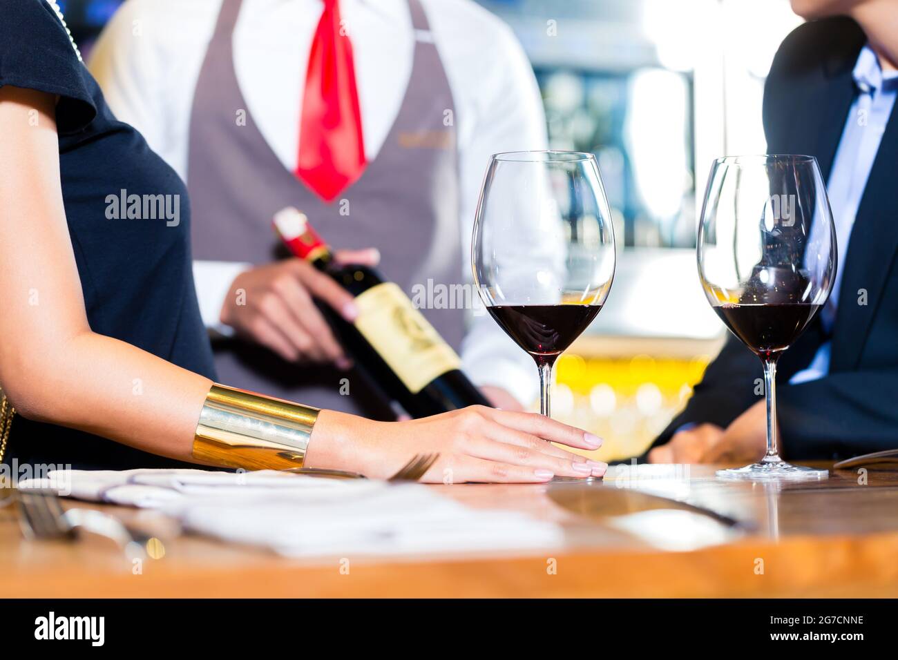 Couple tasting red wine in wine shope Stock Photo