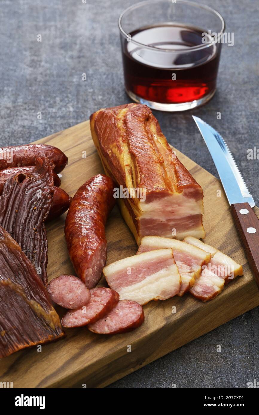 homemade smoked foods; bacon, sausage, beef jerky Stock Photo Alamy