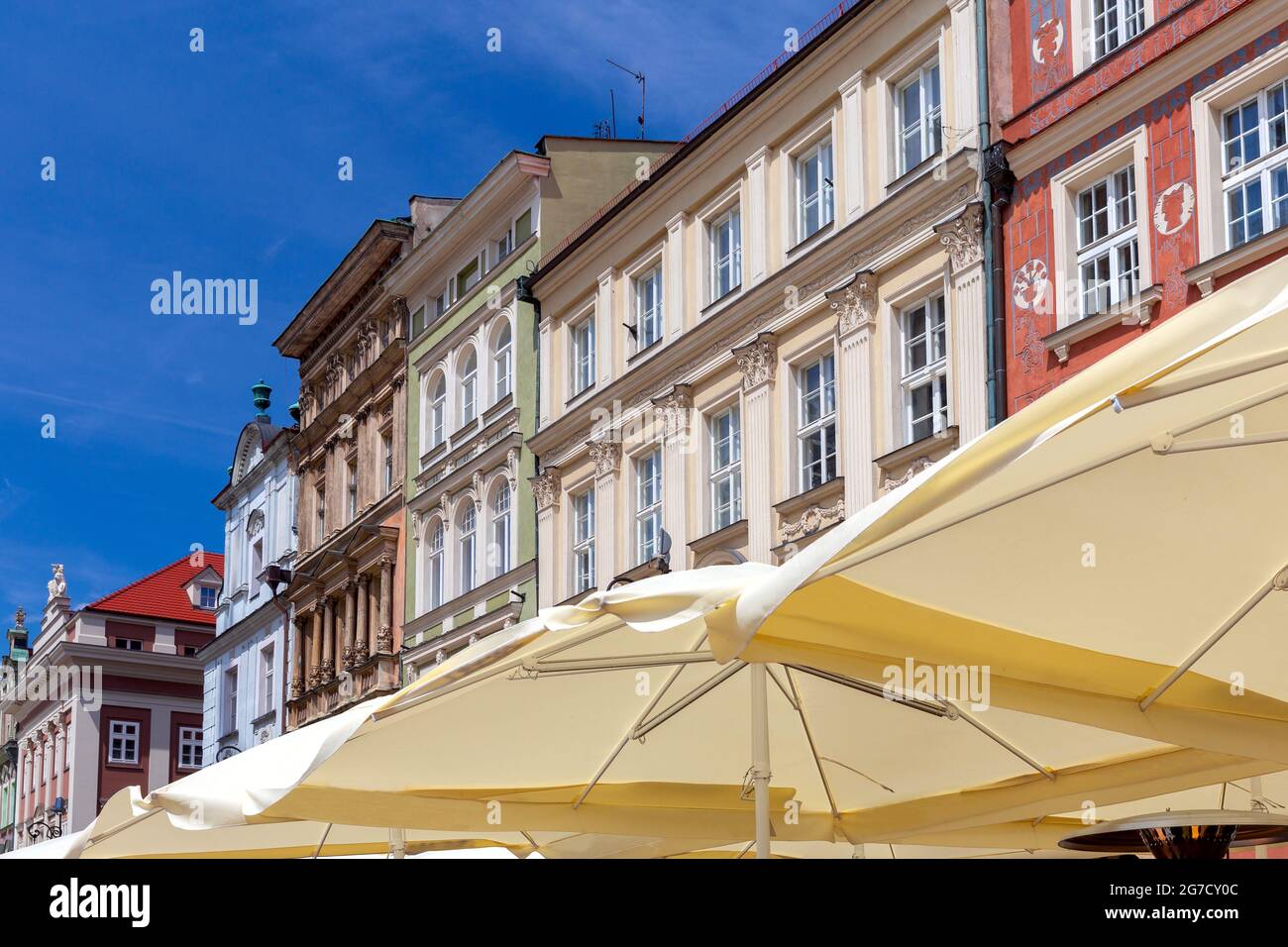 The colorful facades of medieval houses in the market square on a sunny day. Poznan Poland. Stock Photo