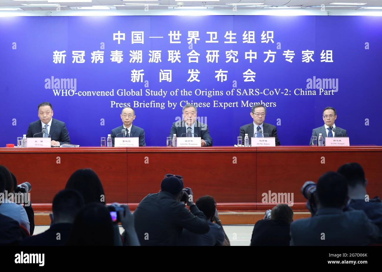 Beijing, China. 31st Mar, 2021. Chinese expert members of a WHO-China joint team introduce the report on the WHO-convened global study of COVID-19 origins at a press briefing in Beijing, capital of China, March 31, 2021. Credit: Zhang Yuwei/Xinhua/Alamy Live News Stock Photo