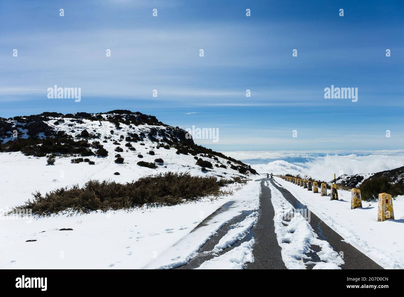 Road to Pico do Areeiro mountain covered with snow in Madeira island