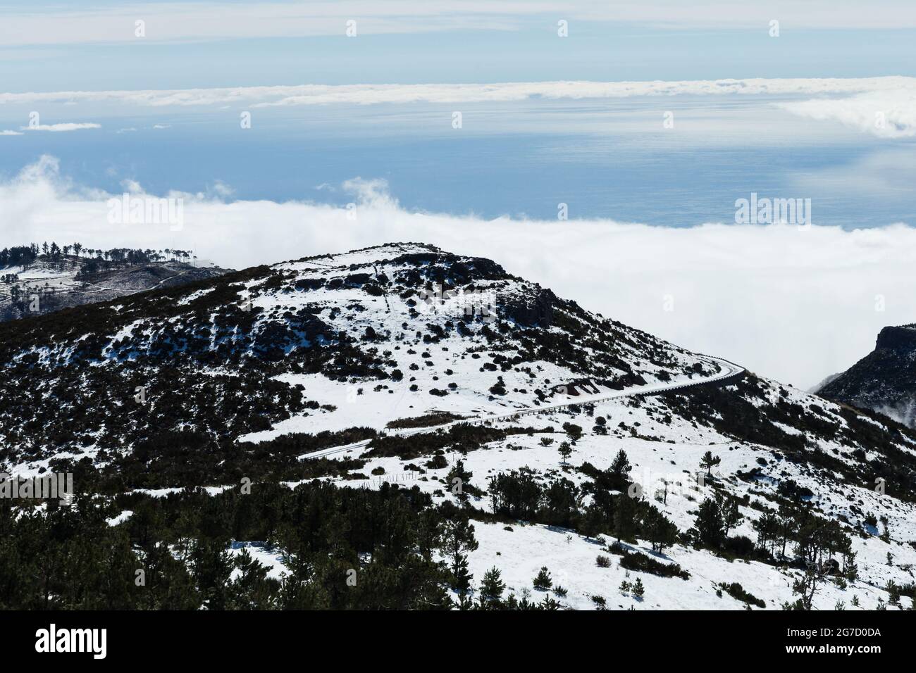 Road to Pico do Areeiro mountain covered with snow in Madeira island