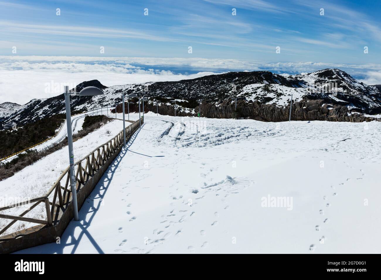 Road to Pico do Areeiro mountain covered with snow in Madeira island