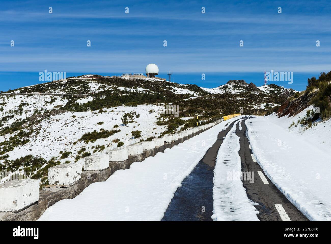 Road to Pico do Areeiro mountain covered with snow in Madeira island