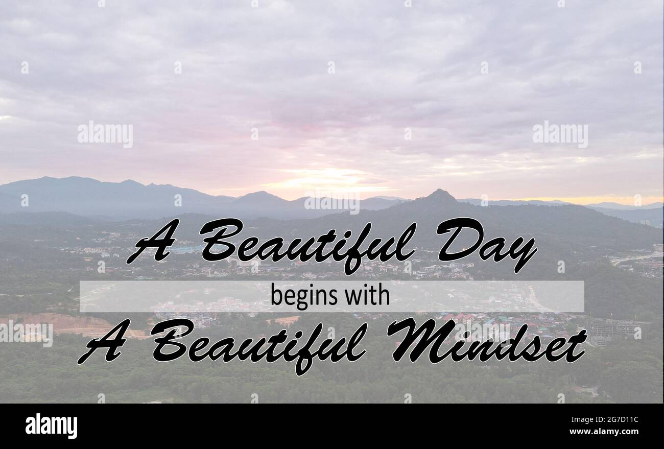 Inspirational and motivational quote. Phrase A beautiful day begins with a beautiful mindset. Blurred background effect Stock Photo