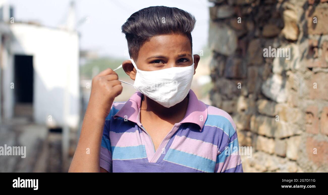 Closeup shot of an Indian boy wearing a mask- new normal concept Stock Photo - Alamy Closeup shot of an Indian boy wearing a mask- new normal concept Stock Photo - Alamy