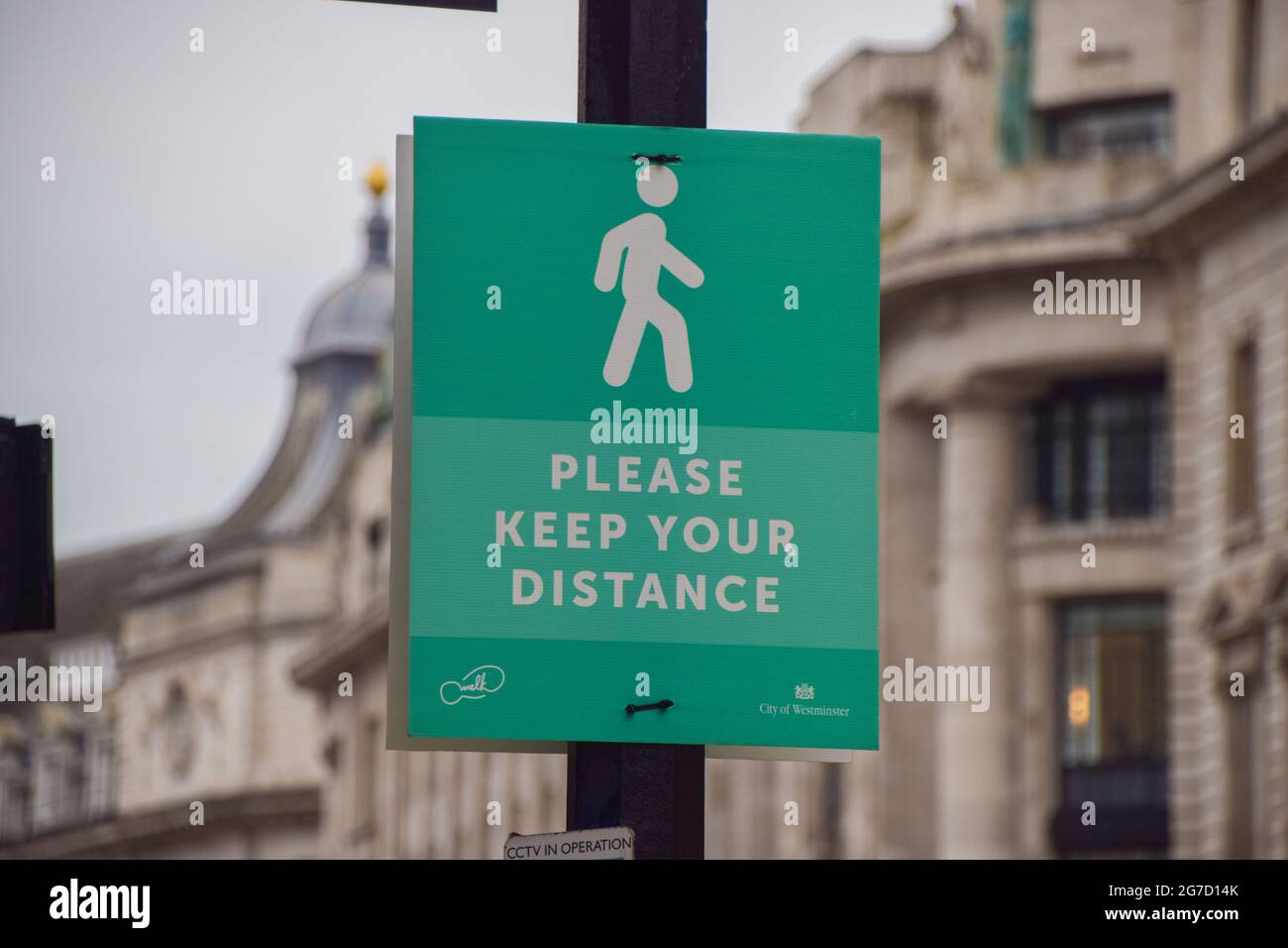 A social distancing sign on Regent Street during the coronavirus pandemic. London, United Kingdom, February 2021. Stock Photo