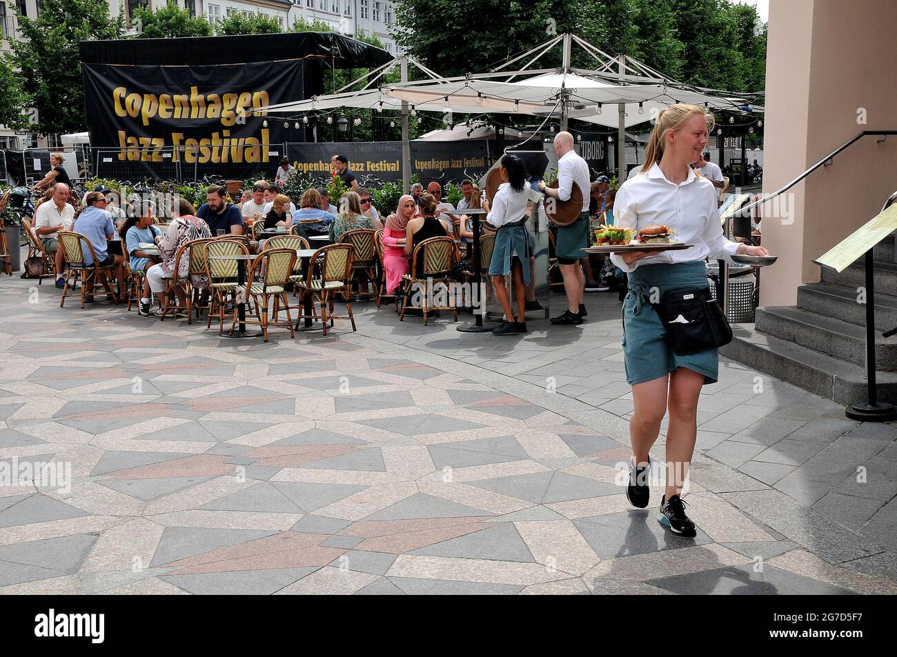 Copenhagen, Denmark. 13 July 2021,Outdoor service at Europacafe on amager torv on stroeget financial street of danish capital.     (Photo..Francis Jos Stock Photo