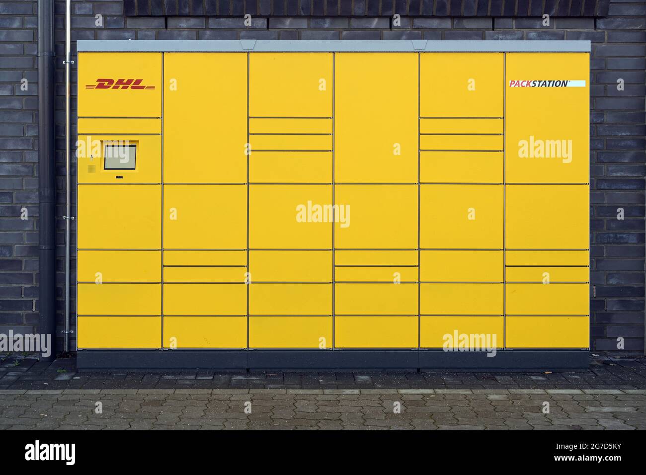 Ratzeburg, Germany, January 12, 2021: Front view of a DHL Packstation (packing station) with boxes where customers can send and pick up their packages Stock Photo