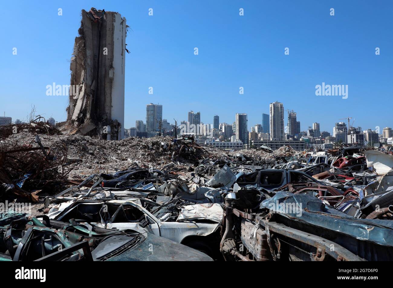 The wreckage of vehicles are pictured near Beirut's destroyed grain silo at the site of the
