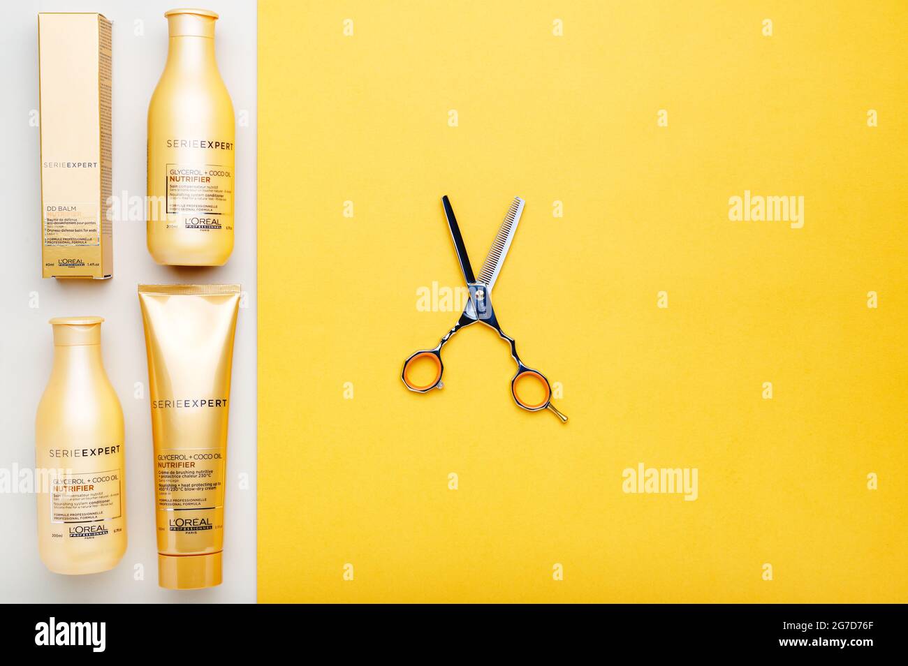 L'oreal professionnel Paris Serie Expert loreal nutrifier hair professional  products set hairdressing scissors. Loreal hair shampoo on yellow color  Stock Photo - Alamy