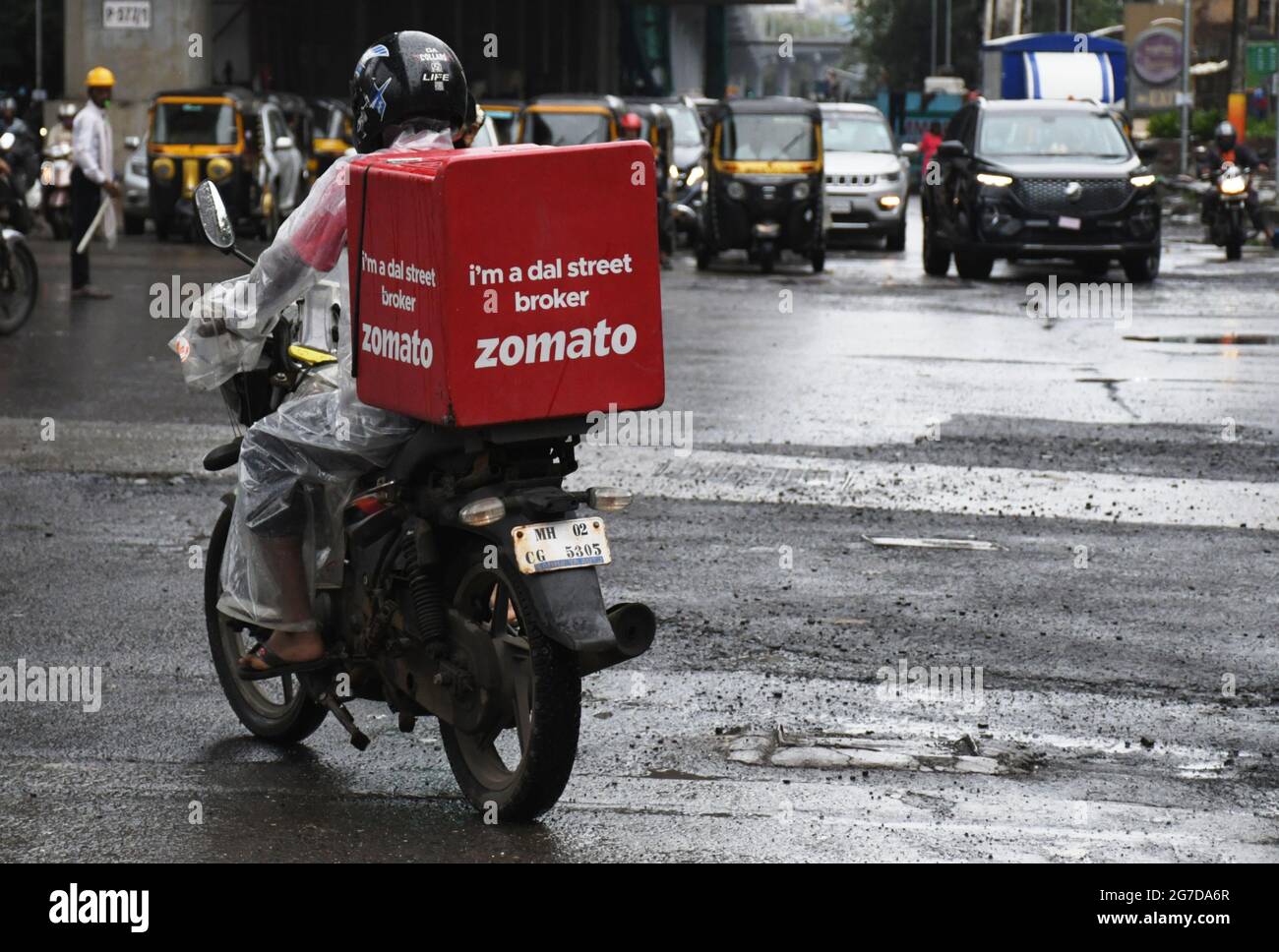 A Zomato delivery man seen riding along the streets of Mumbai.Zomato