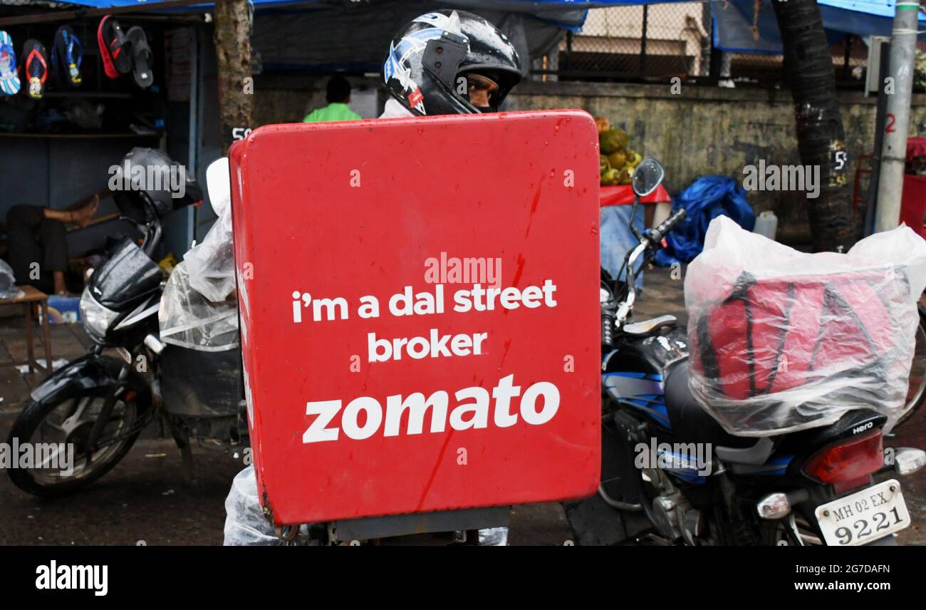 Mumbai, India. 13th July, 2021. A Zomato delivery man seen on the