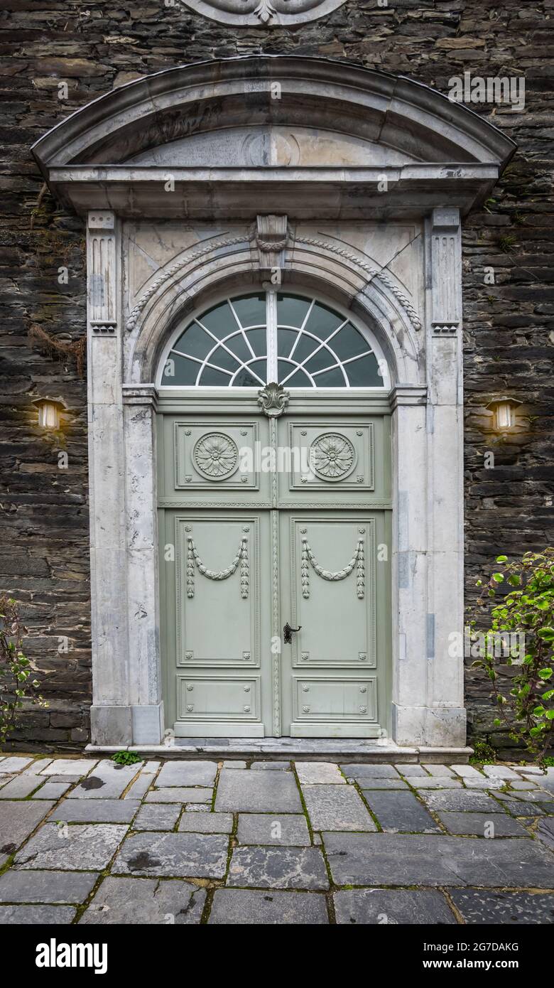 Old wooden door of city church in Monschau, Germany. Stock Photo