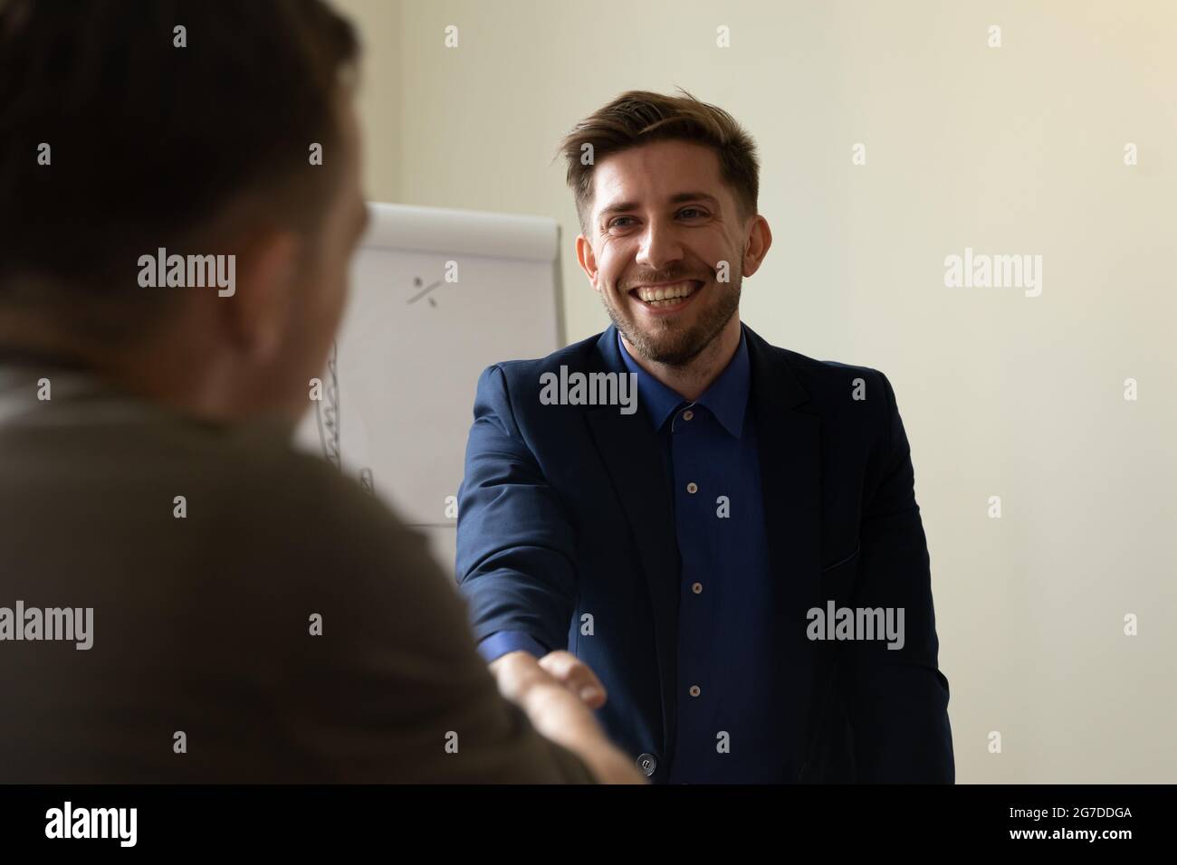 Businessman, client, customer giving handshake to lawyer, thanking for help Stock Photo