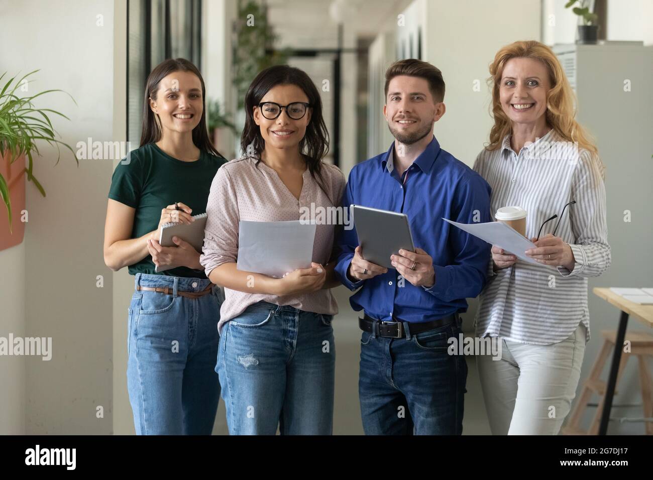 Happy multiethnic different aged business team posing in office Stock Photo