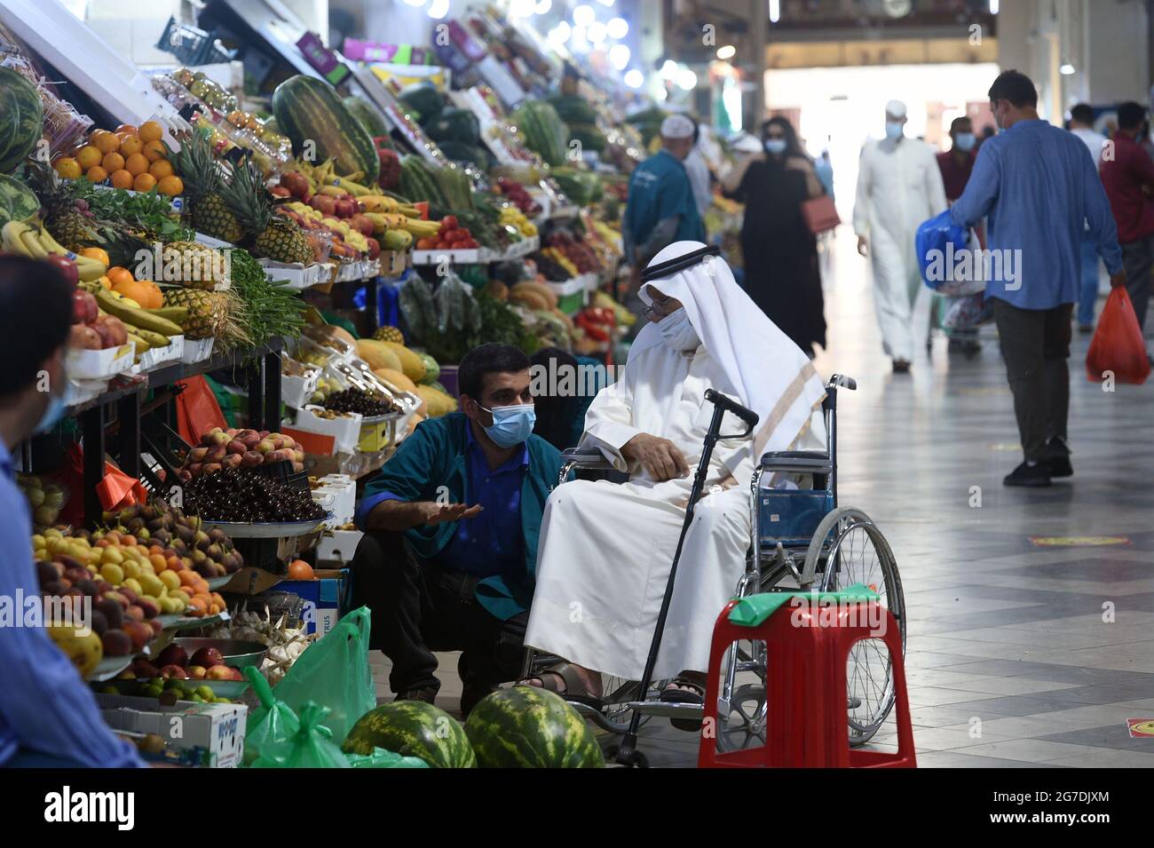 Kuwait City, Kuwait. 13th July, 2021. People shop at AlMubarakiya