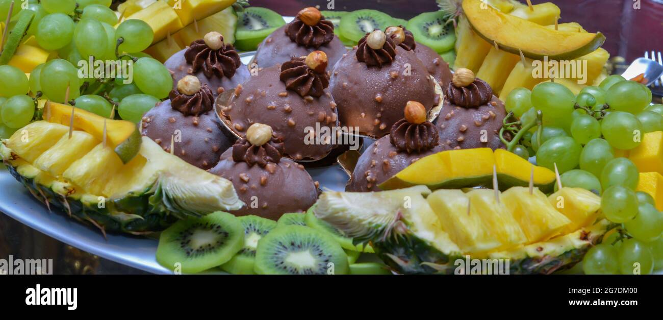 Iced Chocolate Cake With Grapes And Pineapple Stock Photo Alamy